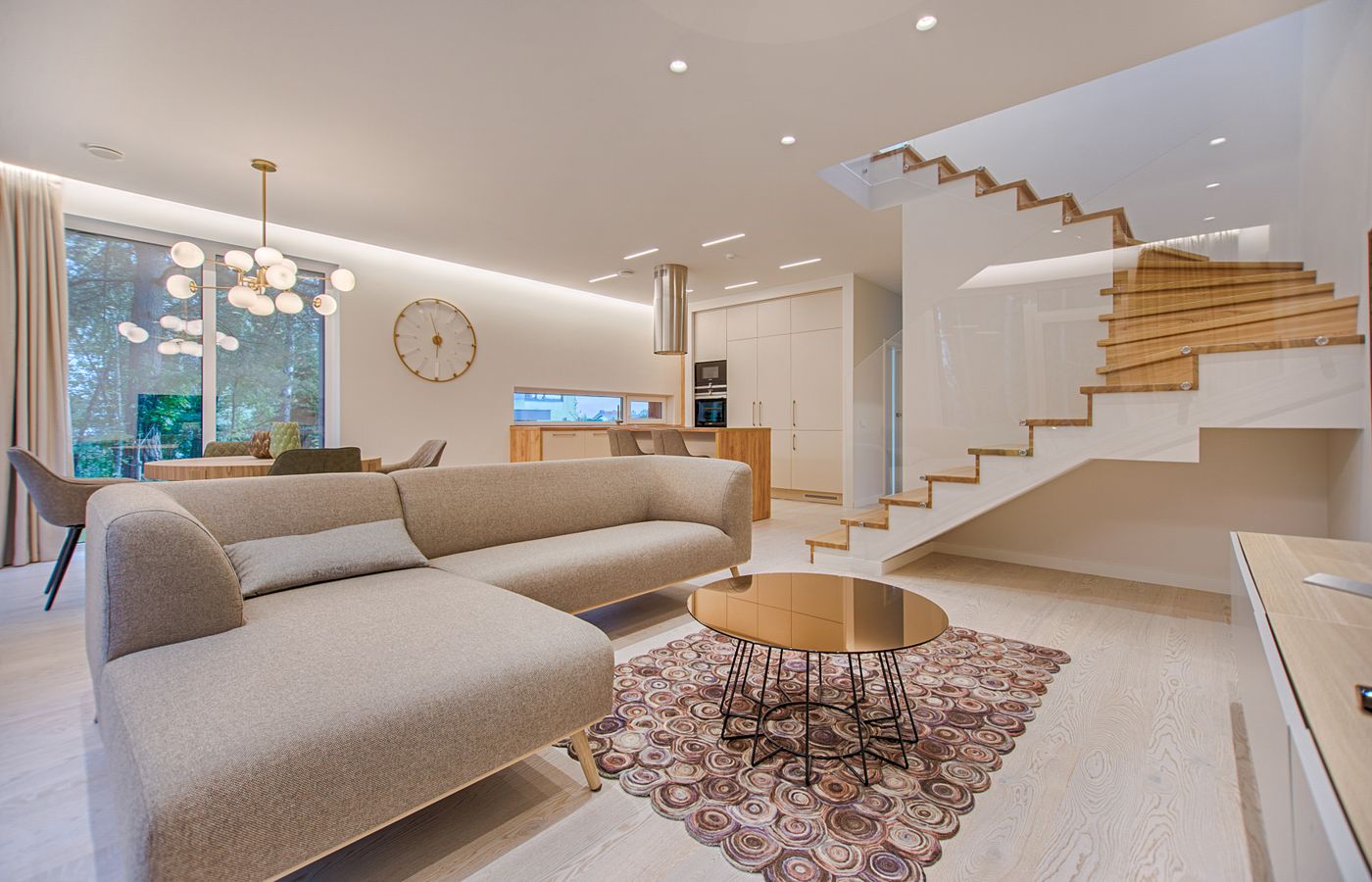 Light-filled residential interior with a staircase