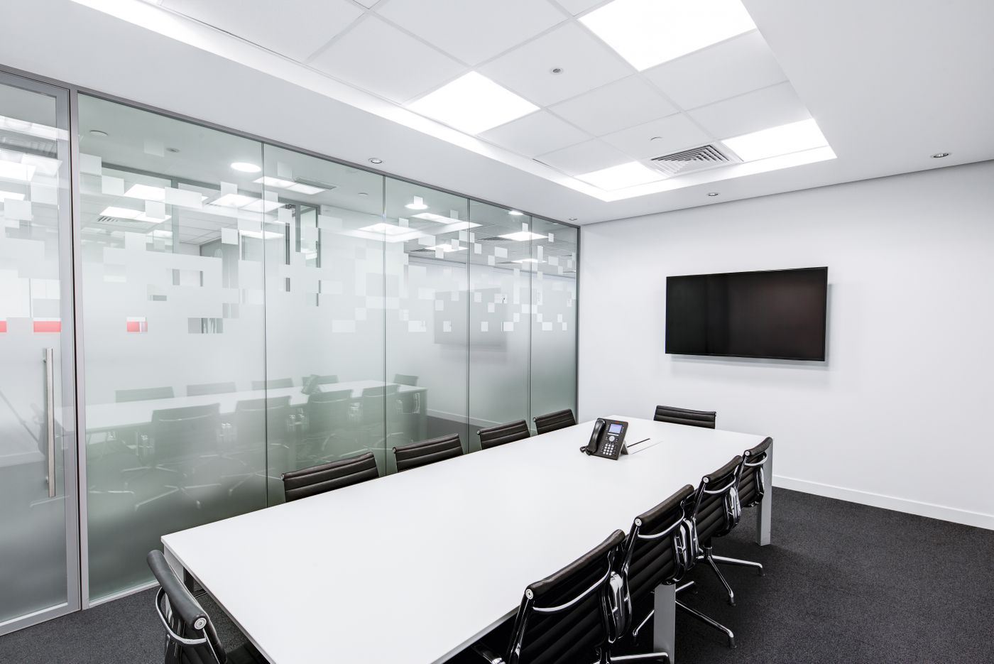 Quiet glass-walled meeting room