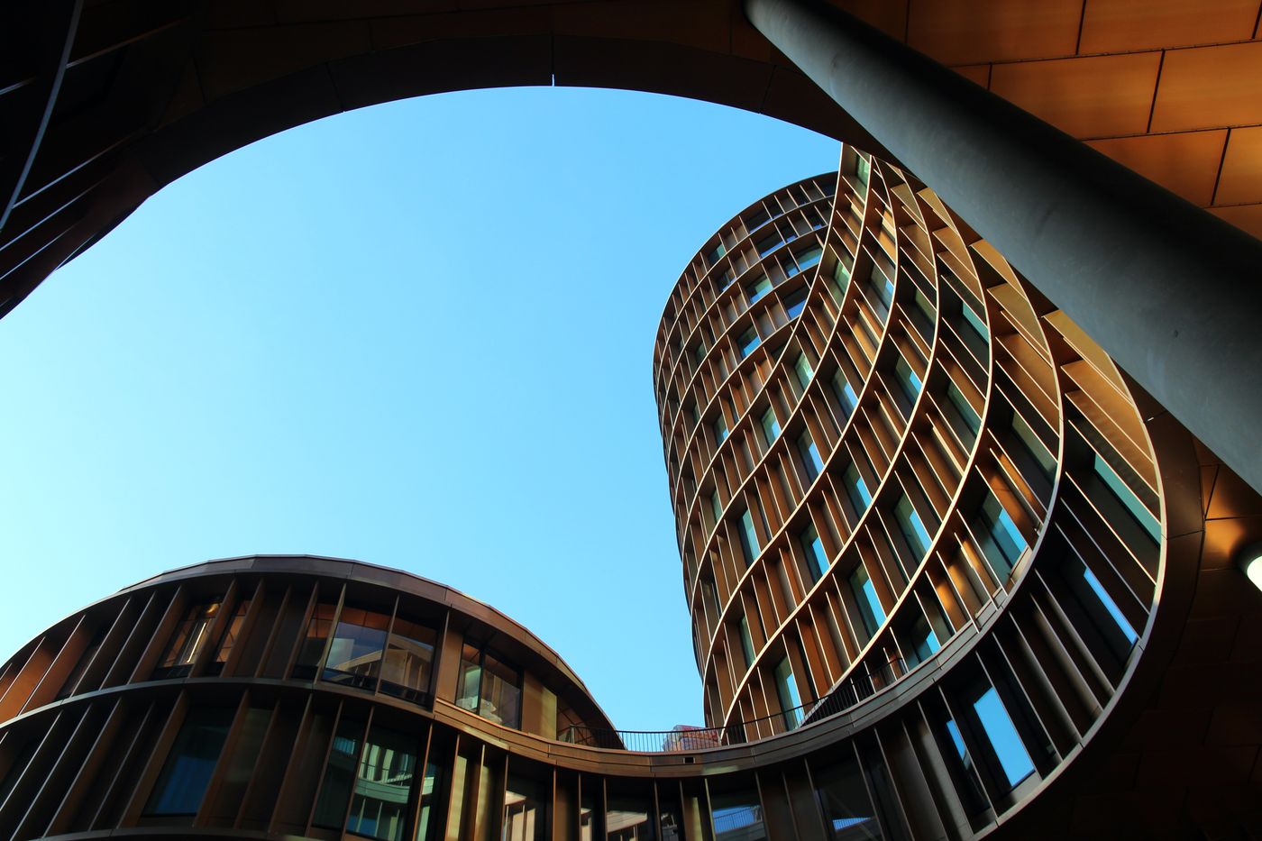 Curved contemporary buildings viewed from below